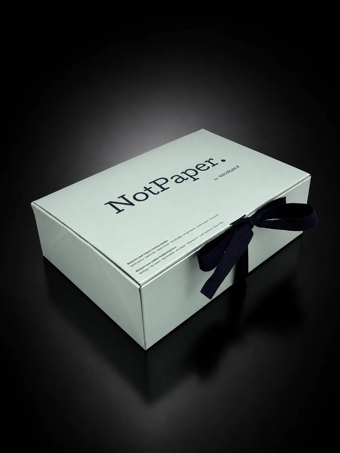 Prototype coffret NotPaper vert pâle avec ruban bleu en perspective